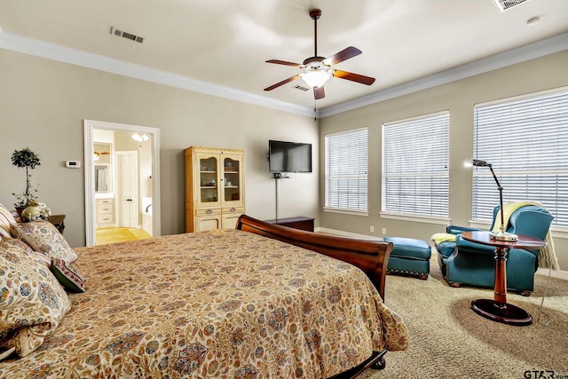 bedroom featuring ensuite bathroom, ceiling fan, multiple windows, and ornamental molding