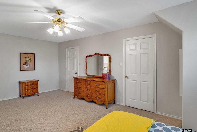 bedroom featuring light colored carpet and ceiling fan