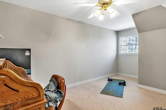 interior space featuring carpet flooring and ceiling fan