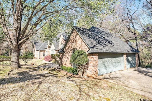 view of side of home with a garage