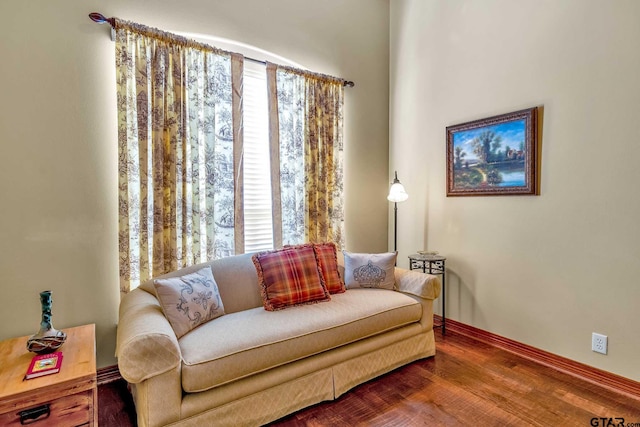 living area with hardwood / wood-style floors