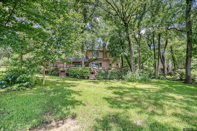 17553 Sleepy Hollow Way, Flint, TX 75762 - view of green lawn with a wooden deck