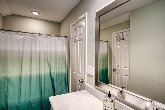17553 Sleepy Hollow Way, Flint, TX 75762 - bathroom with vanity and lofted ceiling