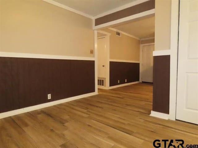 510EMMAST W Emma St, Bullard, TX 75757 - unfurnished room featuring visible vents, crown molding, and wood finished floors