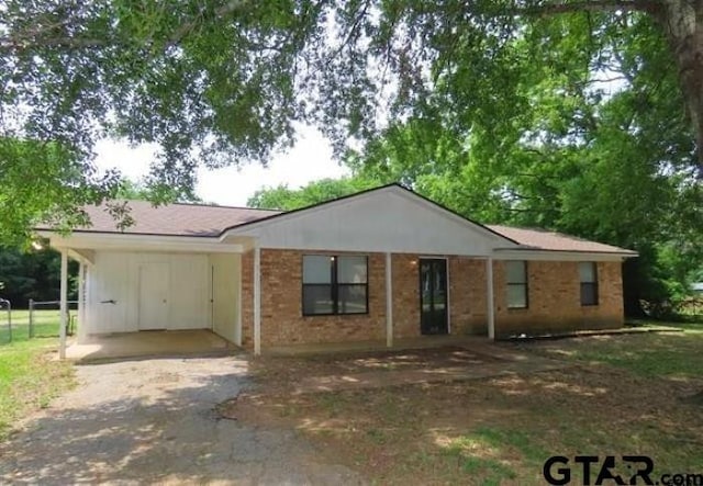 510EMMAST W Emma St, Bullard, TX 75757 - single story home featuring driveway, a carport, and brick siding