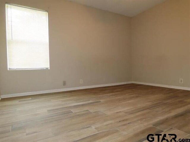 510EMMAST W Emma St, Bullard, TX 75757 - spare room with baseboards and light wood-style floors