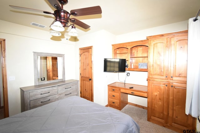 bedroom with light colored carpet and ceiling fan