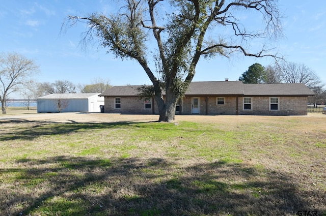 back of house featuring a yard