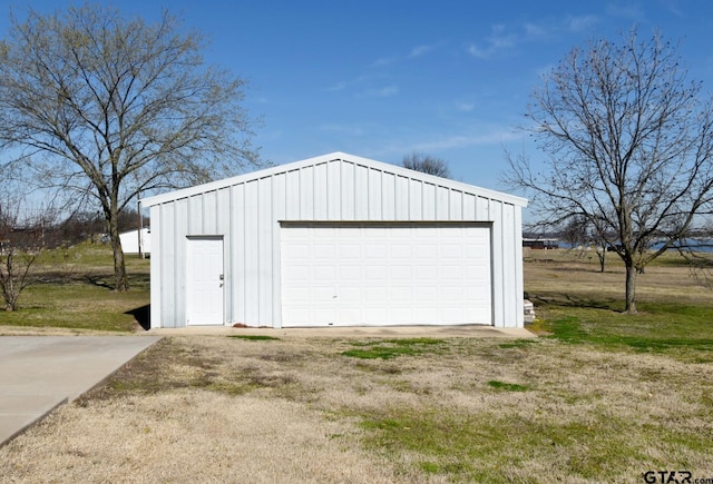 garage featuring a yard