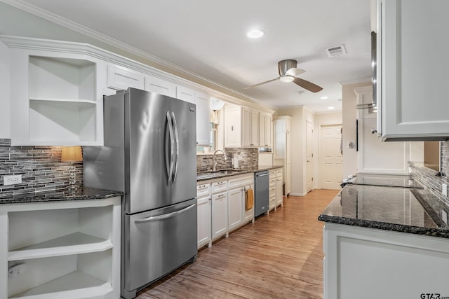 kitchen with open shelves, stainless steel appliances, a ceiling fan, ornamental molding, and a sink