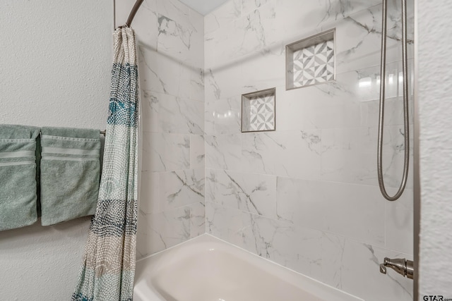 bathroom featuring shower / bath combination with curtain