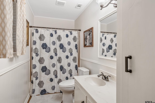 full bathroom with toilet, vanity, crown molding, and a shower with shower curtain