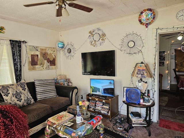 living room featuring a ceiling fan and carpet floors