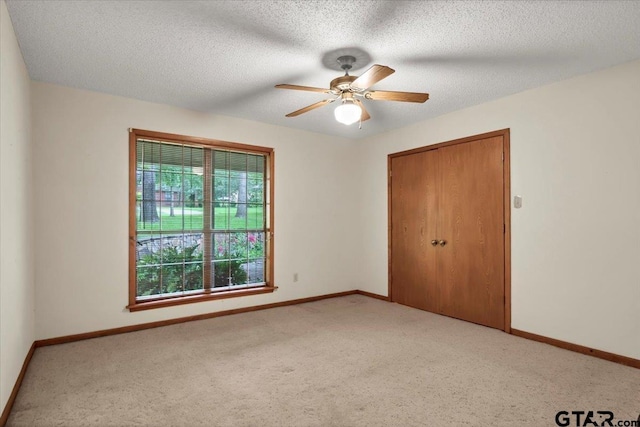 23424BAYSIDE Bay Side Dr, Bullard, TX 75757 - unfurnished bedroom with light colored carpet, a closet, and a ceiling fan
