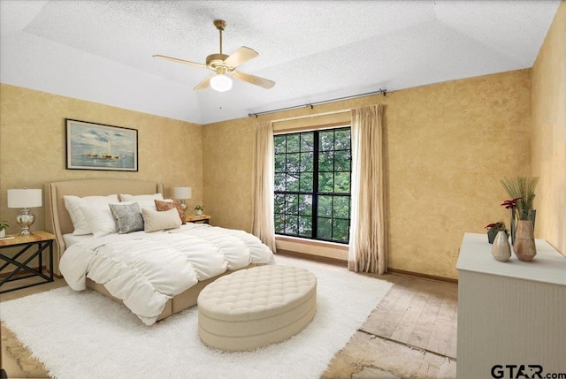 23424BAYSIDE Bay Side Dr, Bullard, TX 75757 - bedroom featuring a ceiling fan, wood finished floors, a textured ceiling, and lofted ceiling