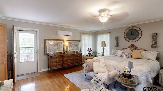 bedroom featuring multiple windows, an AC wall unit, wood finished floors, crown molding, and baseboards