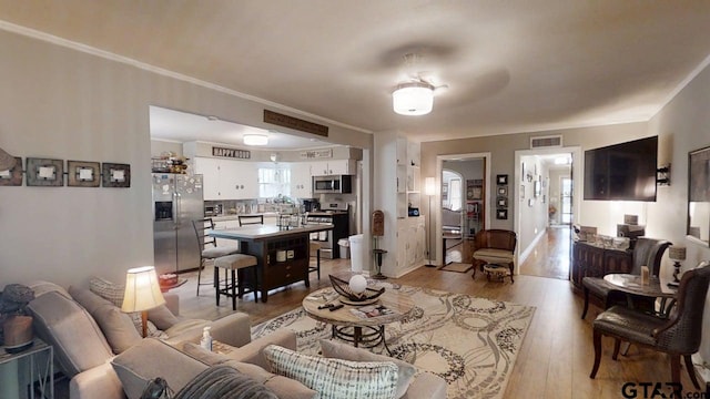 living area with light wood-style floors