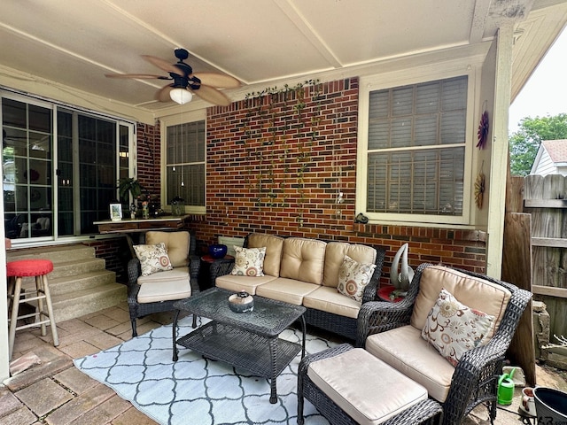 view of patio / terrace with a ceiling fan, an outdoor living space, and fence