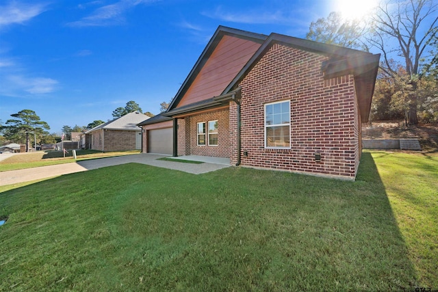 view of home's exterior featuring a lawn and a garage