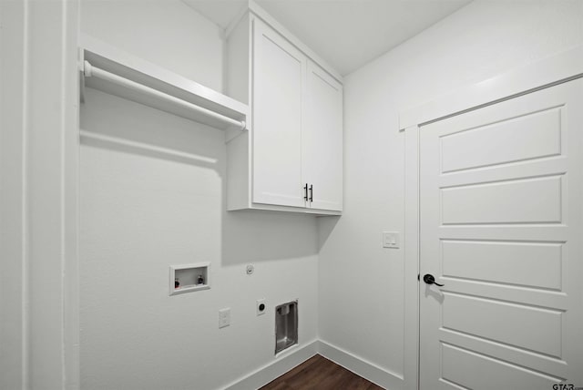 laundry room with dark wood-type flooring, cabinets, hookup for an electric dryer, gas dryer hookup, and hookup for a washing machine