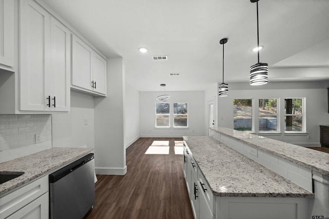 kitchen featuring light stone countertops, dark wood-type flooring, white cabinets, and stainless steel dishwasher