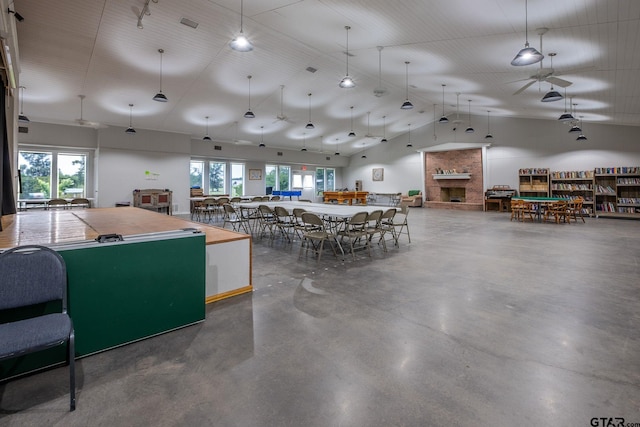 kitchen with concrete floors and high vaulted ceiling