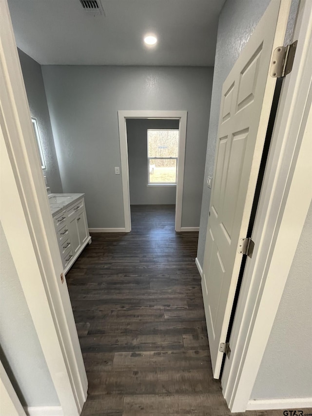 hallway featuring dark hardwood / wood-style floors