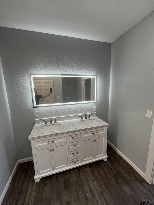 bathroom with vanity and hardwood / wood-style floors