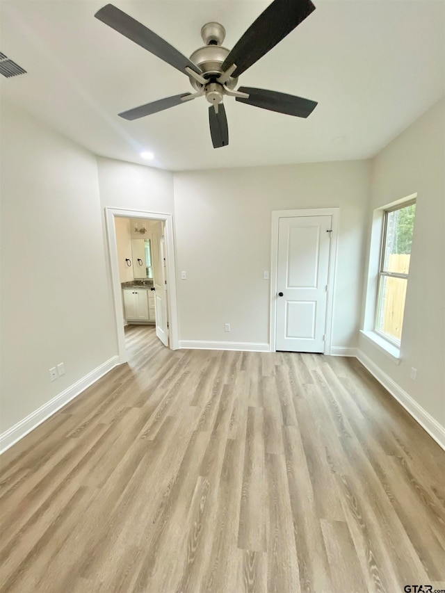 interior space with ceiling fan and light hardwood / wood-style floors