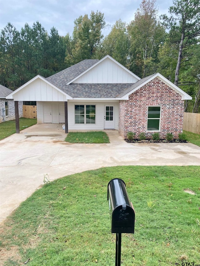 single story home with a carport and a front yard