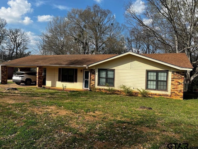 single story home with a carport and a front yard