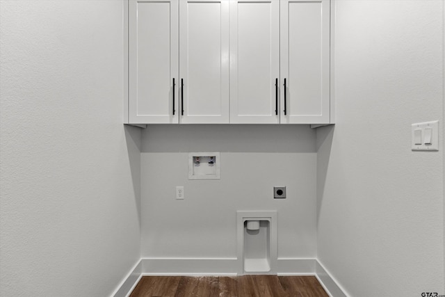 laundry room featuring dark hardwood / wood-style flooring, hookup for a washing machine, cabinets, and hookup for an electric dryer