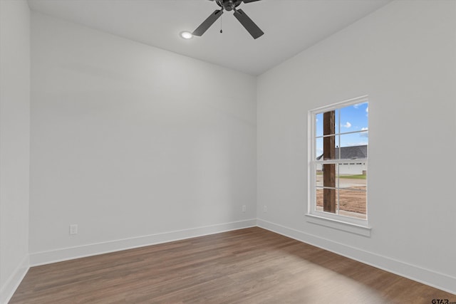 unfurnished room featuring hardwood / wood-style flooring and ceiling fan