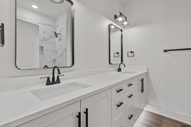 bathroom featuring hardwood / wood-style floors and vanity