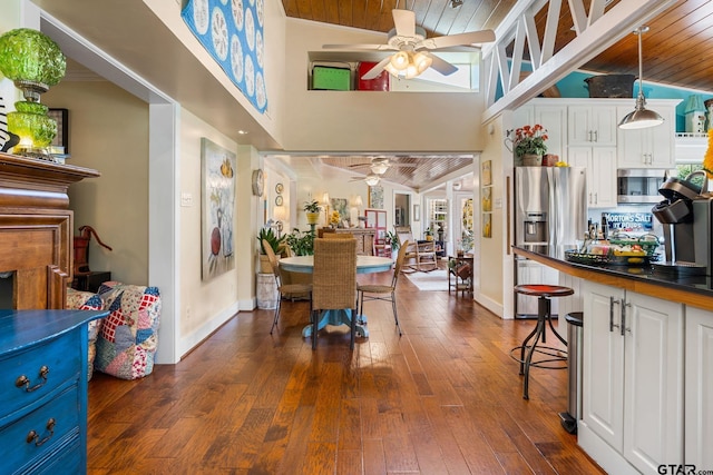 dining area with plenty of natural light, ceiling fan, and wood ceiling