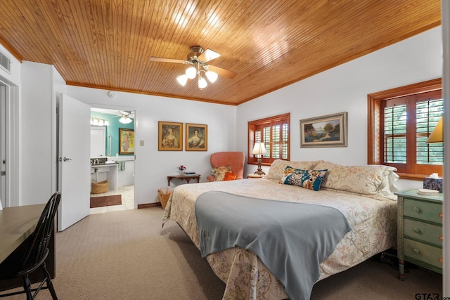 carpeted bedroom with wooden ceiling, ceiling fan, multiple windows, and connected bathroom