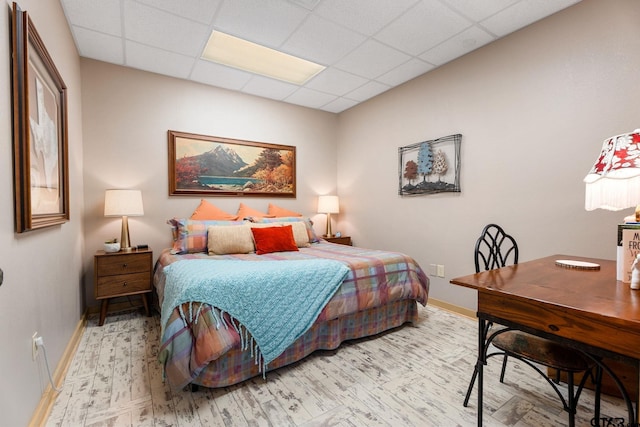 bedroom featuring a paneled ceiling