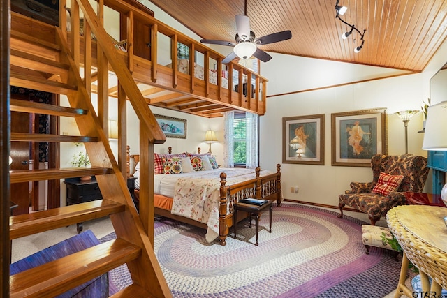 bedroom with lofted ceiling, wood ceiling, and ceiling fan