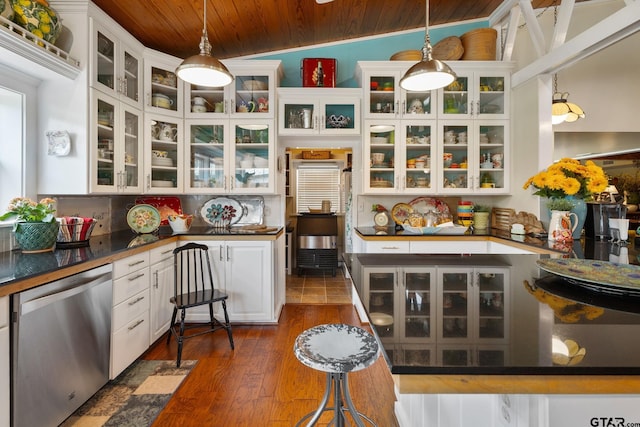 kitchen with white cabinetry, hanging light fixtures, stainless steel dishwasher, lofted ceiling, and wooden ceiling