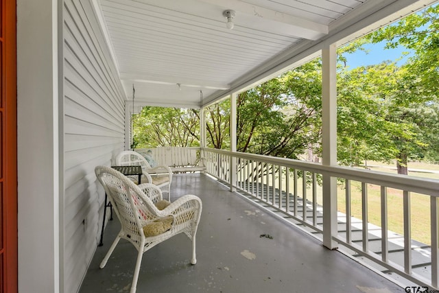 balcony featuring a porch