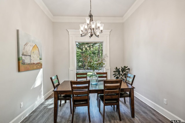 dining space with ornamental molding, a notable chandelier, and dark hardwood / wood-style floors