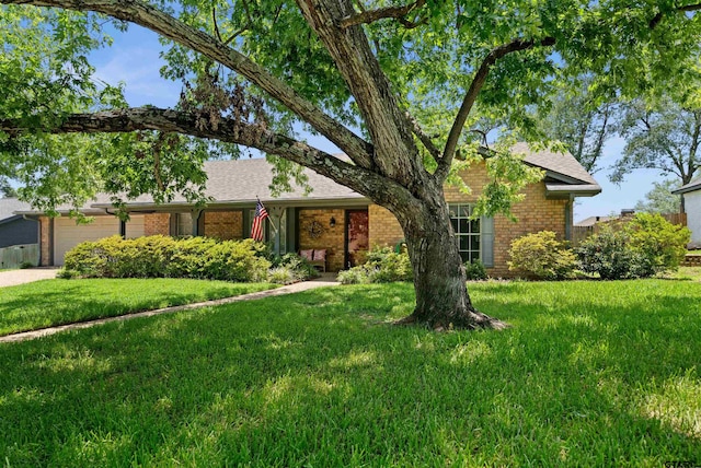 608 Meadow Crk, Tyler, TX 75703 - ranch-style house with brick siding, an attached garage, a front lawn, and a shingled roof