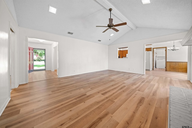 608 Meadow Crk, Tyler, TX 75703 - unfurnished living room featuring light wood finished floors, a chandelier, washer / dryer, a ceiling fan, and a textured ceiling