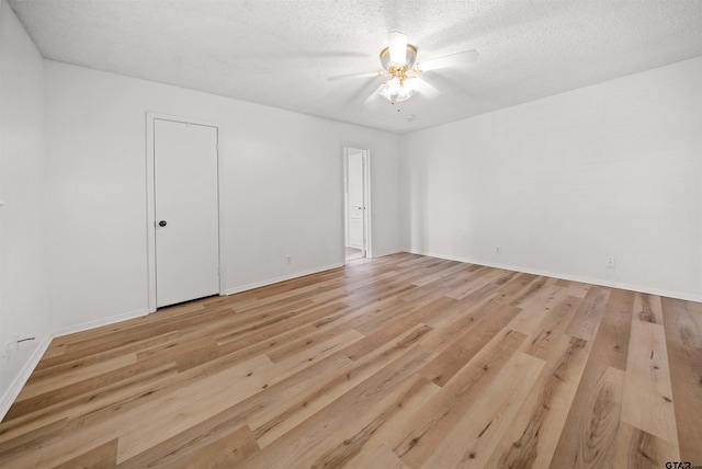 608 Meadow Crk, Tyler, TX 75703 - spare room with ceiling fan, light wood-style flooring, and a textured ceiling