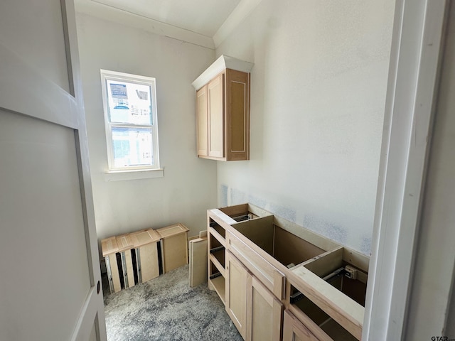 kitchen with carpet and light brown cabinetry