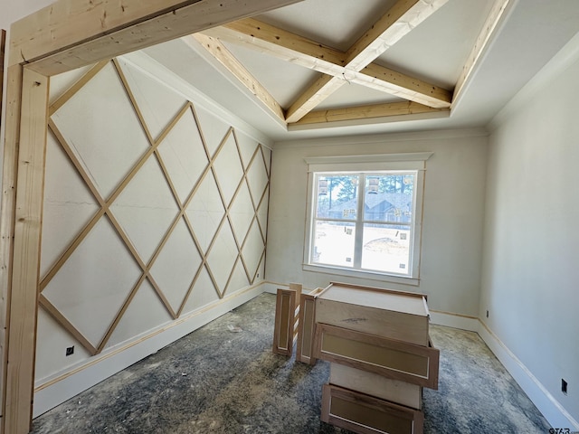 spare room with baseboards, coffered ceiling, and beam ceiling