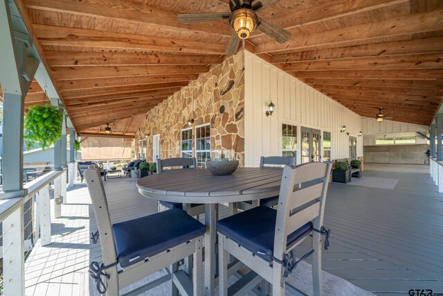 view of patio featuring outdoor dining space, french doors, and a ceiling fan