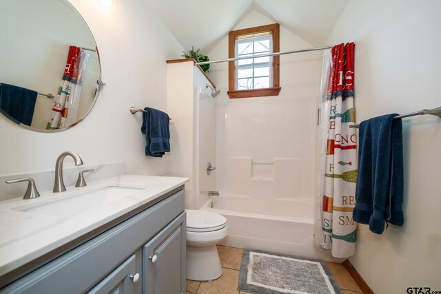 bathroom featuring toilet, vanity, shower / bath combo, lofted ceiling, and tile patterned flooring