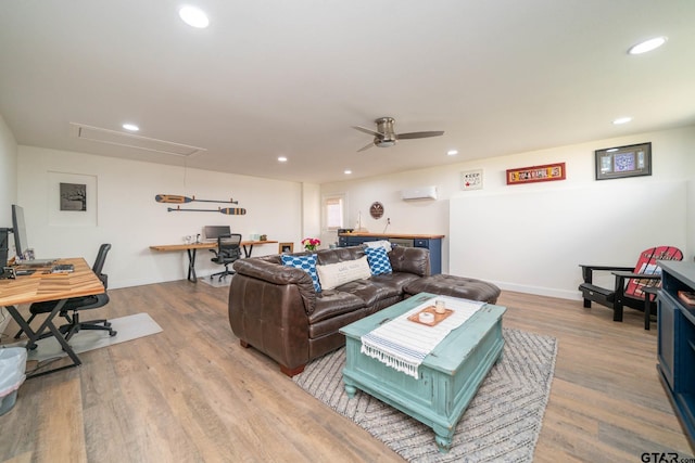 living area with attic access, wood finished floors, and recessed lighting