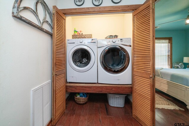 washroom with hardwood / wood-style floors, washing machine and clothes dryer, laundry area, and visible vents